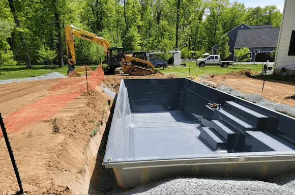 Hardscape and patio installation around a new inground pool